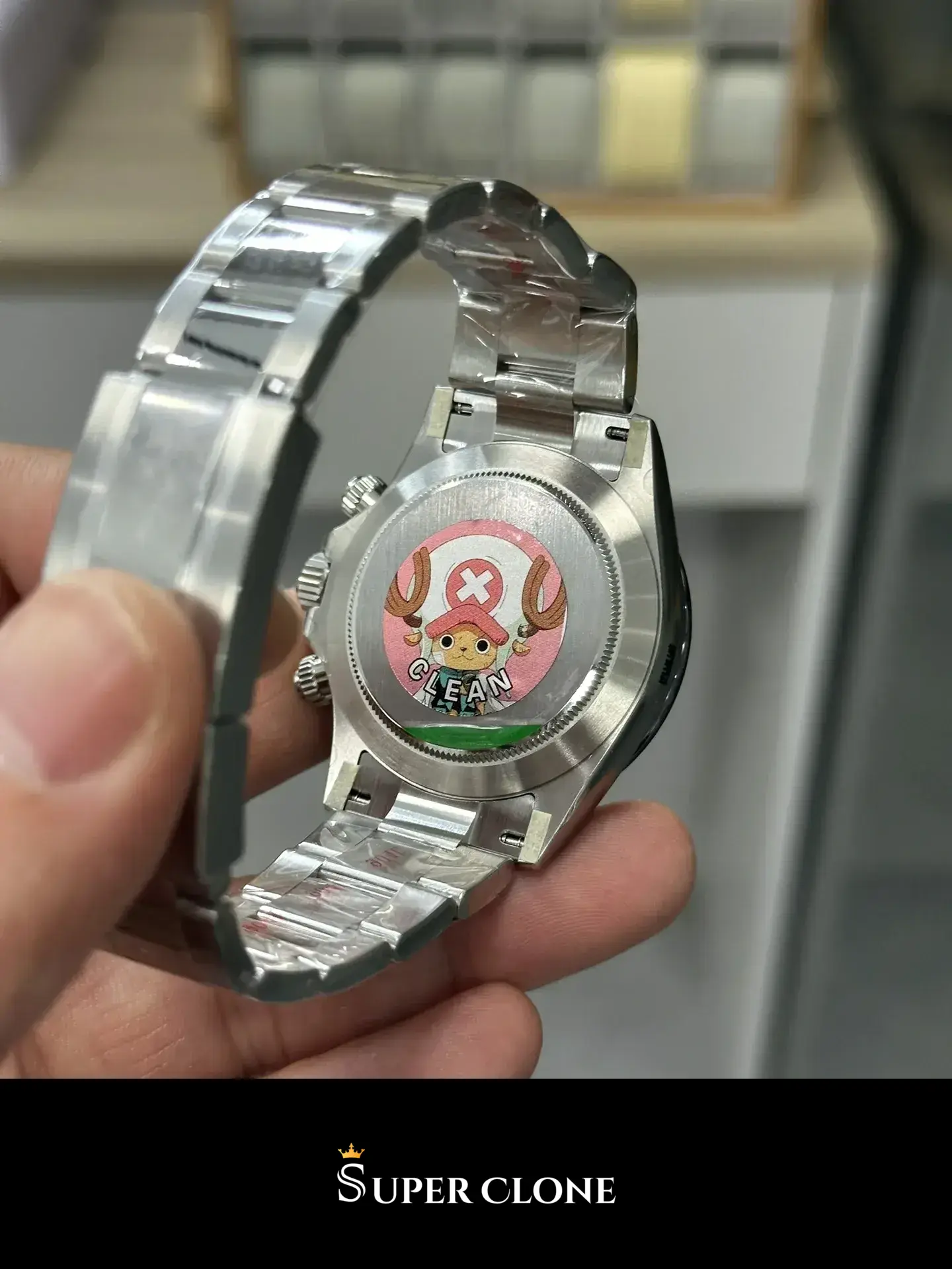 Rolex Daytona 116500LN replica, vista en muñeca, esfera blanca